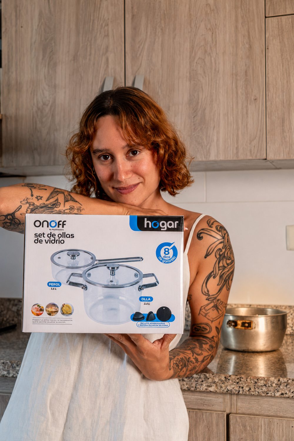 A woman holding a boxed set of Onoff glass pots